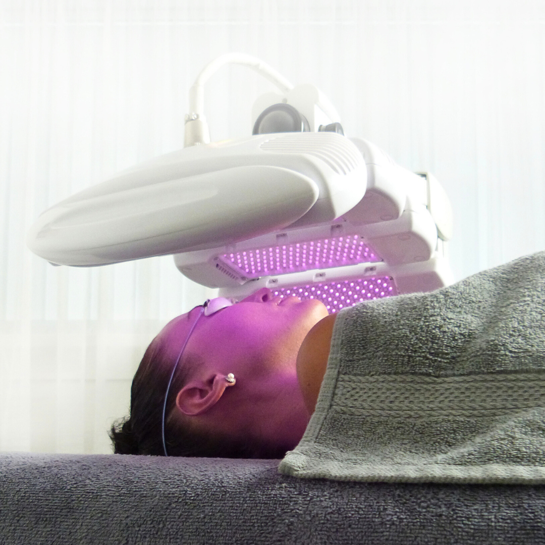 dermalux tri wave md machine is being used for skin treatment
